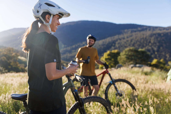 norman founder jacinta timmins outdoors with a mountain bike